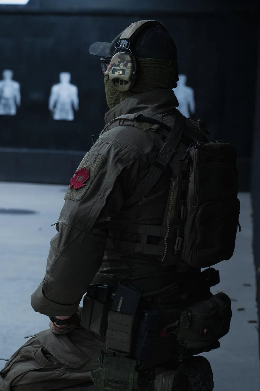 T4F instructor overseeing firearms training at an indoor range